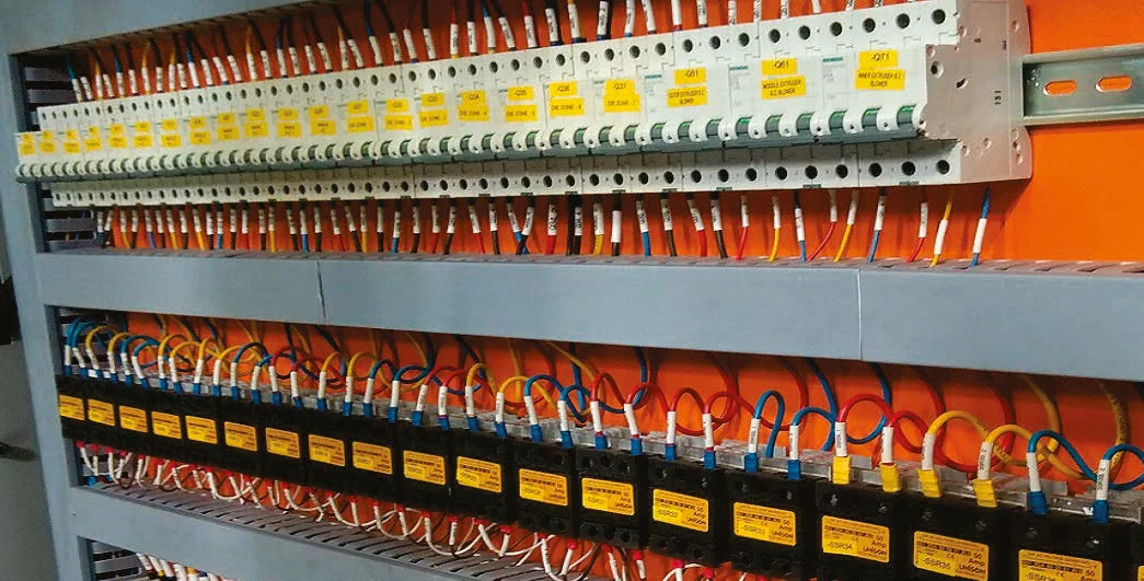 Rows of Unison relays on heat sinks inside a control panel